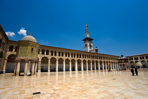 Syria. Damascus. Omayyad Mosque (Grand Mosque of Damascus) - northern part of courtyard with the Dome of the Treasury on left side (Qubbat al-Khazna) and the Minaret of the Bride (Madhanat al-Arus) in the middle