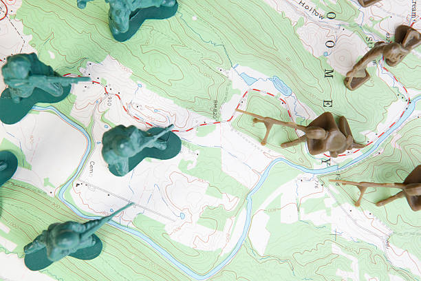 istock Overhead View Plastic Army Men Fighting Battle on Topographic Map. 155236777