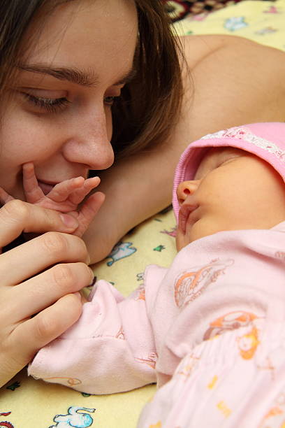 istock mother kissing her small child 155237245