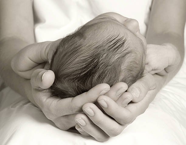 istock Mother holding baby daughter 155237337