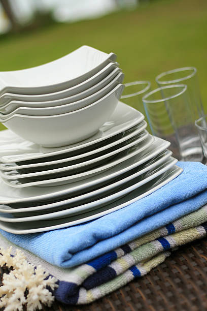 Set of ceramic plates and glassware at resort stock photo