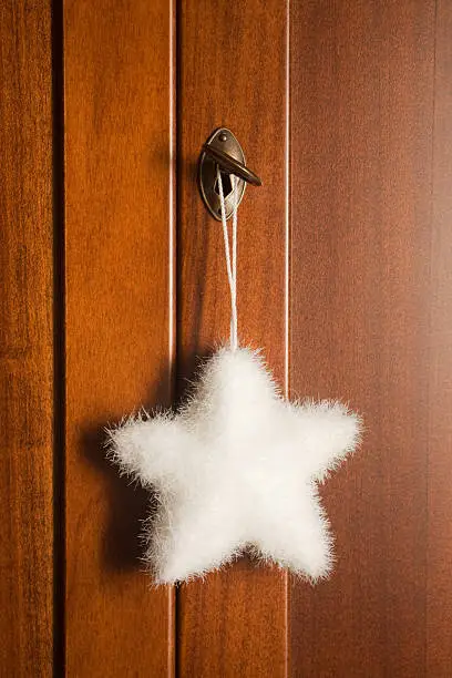 White Christmas star hanging from a key