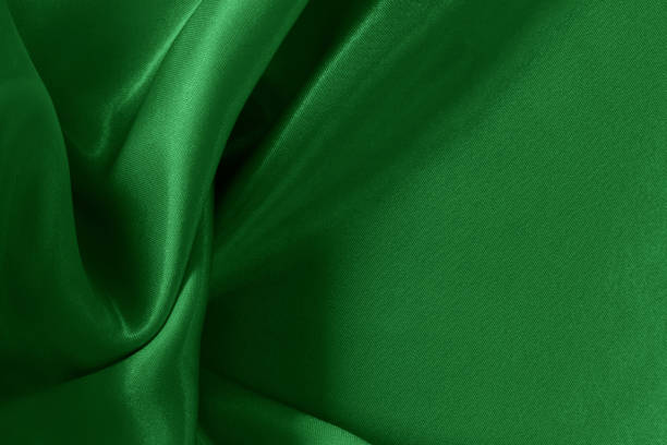 istock Green emerald fabric texture background, detail of silk or linen pattern. 1552389598