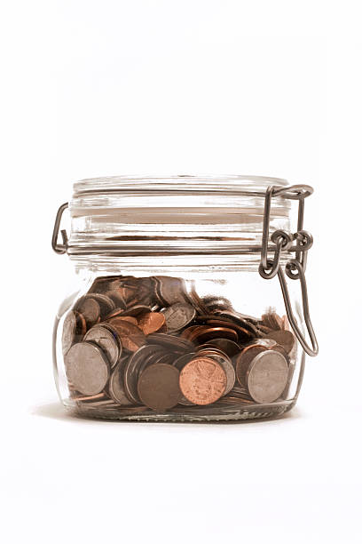 Jar of coins - foto de acervo