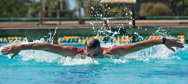 Man Racing in Swim Meet stock photo