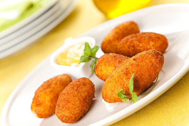 istock Ham and cheese croquettes on a white plate with sauce 155239251