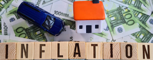 istock Inflation machine house and euro banknotes closeup 1552393676