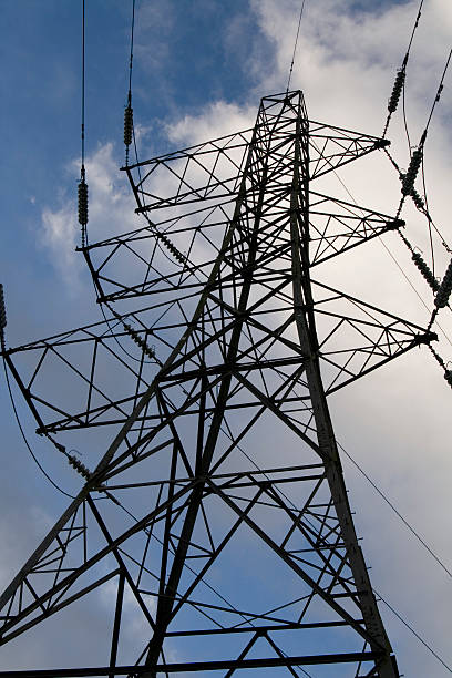 Electricity Pylon clouds and sky stock photo