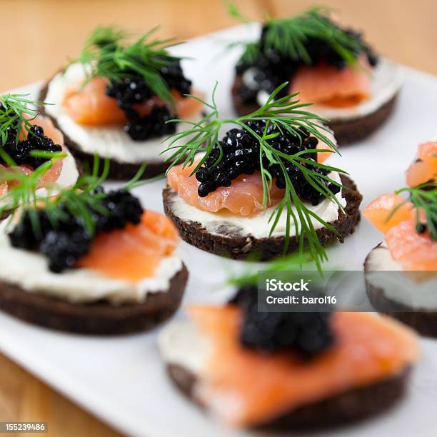 Canapes With Salmon And Caviar Stock Photo - Download Image Now - Caviar, Smoked Salmon, Brown Bread