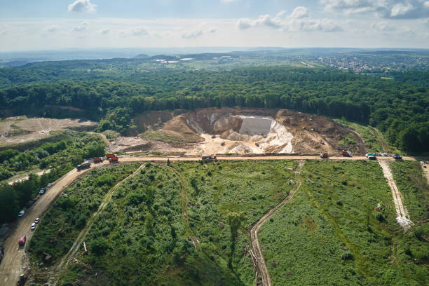istock Aerial view of open pit mining of limestone materials for construction industry with excavators and dump trucks 1552395366