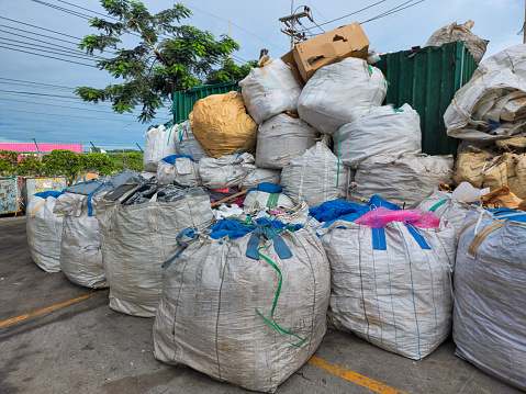 Large garbage bags that have been sorted and waiting to be transported to the waste disposal point.