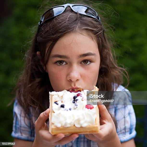Girl Eating Waffle With Cream And Fruits Stock Photo - Download Image Now - Child, Waffle, 14-15 Years