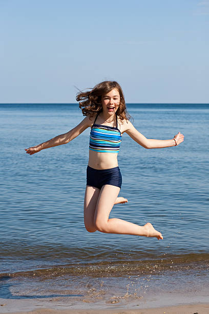 istock Girl jumping outdoor 155239593