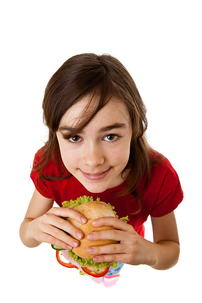 istock Girl eating sandwich isolated on white 155239646