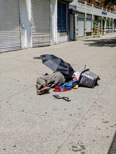 Homeless man sleep on street NY stock photo