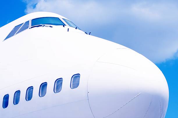 istock airplane in air on blue sky 155240403