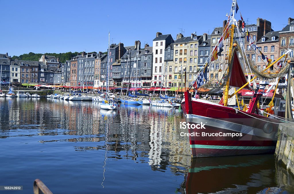 Honfleur, France - Boats This beautiful seaport town is as picturesque as it looks.   Situated in the Calvados region of France (Normandy) Honfleur somehow escaped the ravages of WWII,  and has managed to preserve the traces of a rich historical past.  Often considered the birthplace of Impressionism, and remains on of the most painted scenes in France. Honfleur Stock Photo