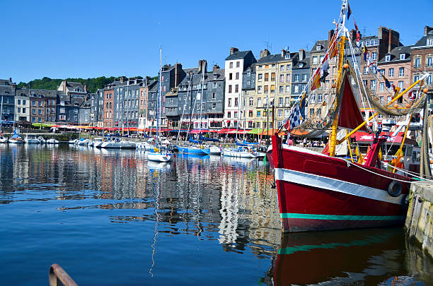 Honfleur, France - Boats This beautiful seaport town is as picturesque as it looks.   Situated in the Calvados region of France (Normandy) Honfleur somehow escaped the ravages of WWII,  and has managed to preserve the traces of a rich historical past.  Often considered the birthplace of Impressionism, and remains on of the most painted scenes in France. normandy stock pictures, royalty-free photos & images