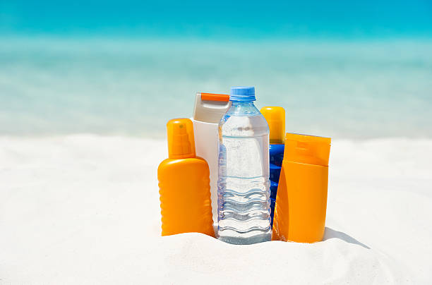 istock water and sun protection cream on beach background 155242661