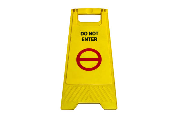 istock do NOT ENTRY sign in black text with red circle icon on yellow object. Warning sign on the floor isolated on white background with shadow and clipping path. 1552429287