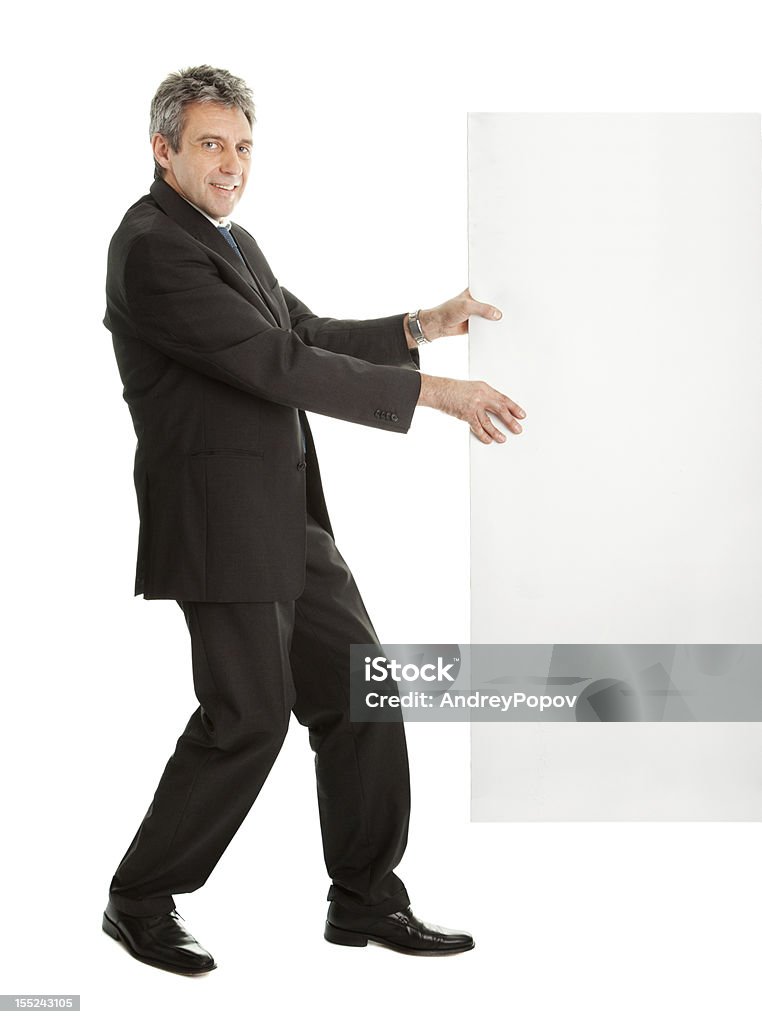 Confident businessmen pulling empty board Confident businessmen pulling empty board. Isolated on white Active Seniors Stock Photo