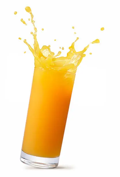 glass of splashing orange juice isolated on white