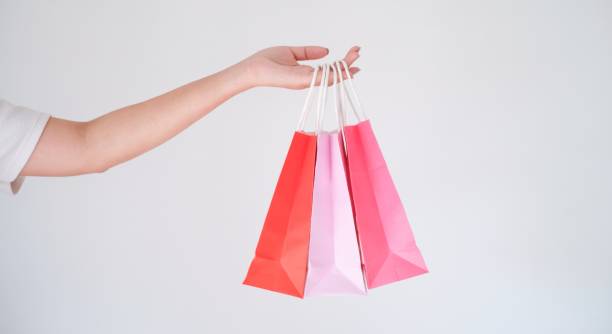 istock woman holding shopping bag 1552445340