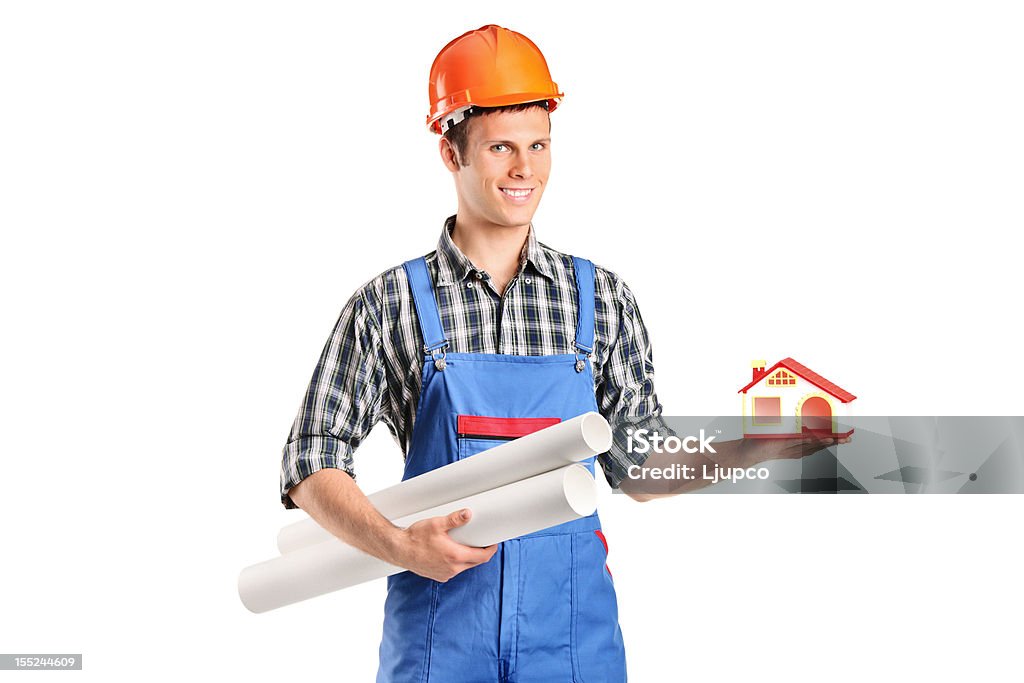 Masculino Trabalhador da Construção Civil segurando um modelo de uma casa e projectos - Royalty-free 20-29 Anos Foto de stock