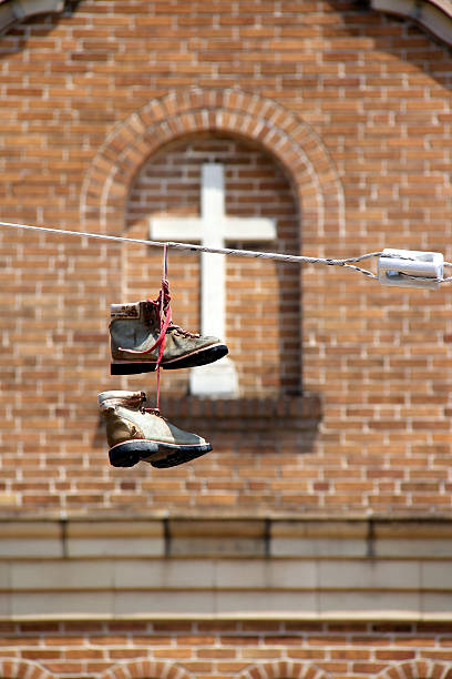 Boots on a Power Line stock photo