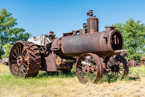 An old steam engine thresher on the prairies in Saskatchewan