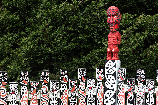 Maori carved poles in New Zealand  Maori carvings in Rotorua, North Island, New Zealand rotorua stock pictures, royalty-free photos & images