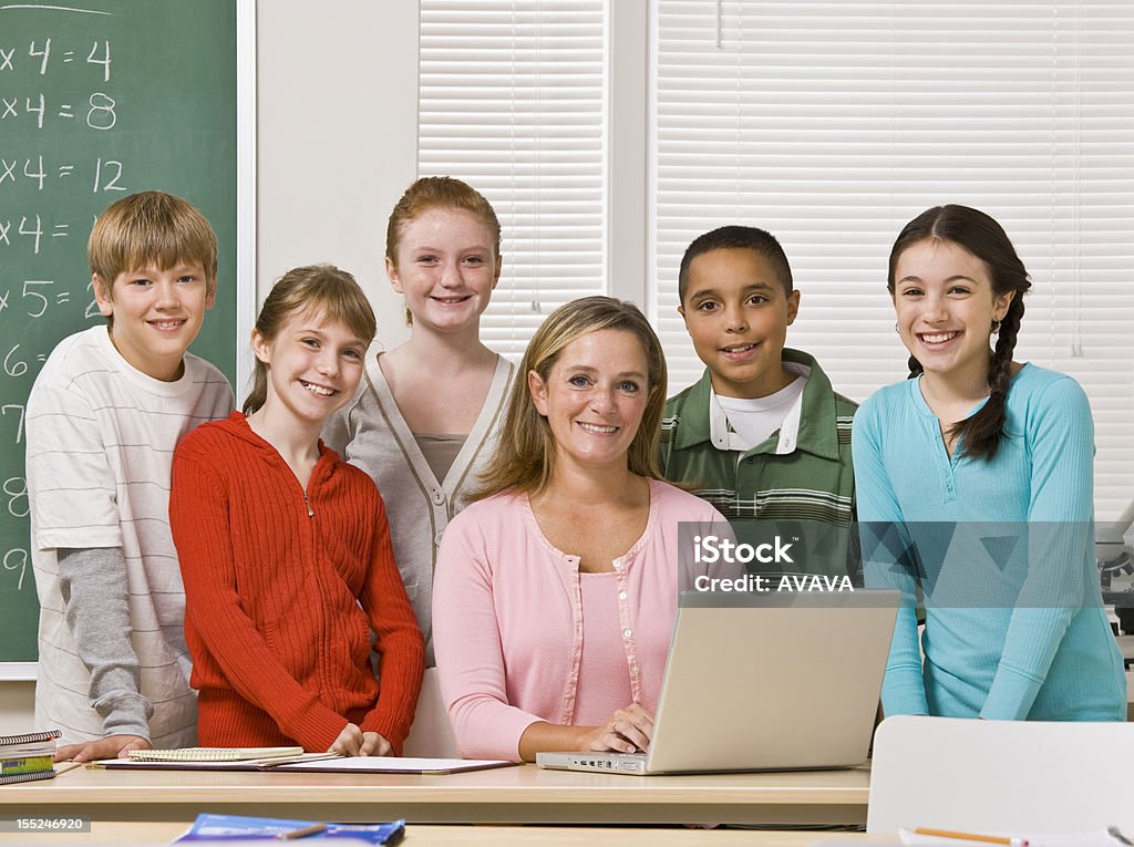 Teacher Posing With Students Stock Photo - Download Image Now - 30