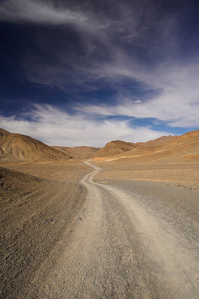 istock Track in the stones desert 155247728
