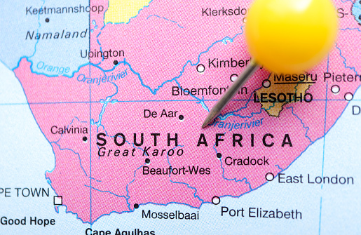 Location South Africa map, yellow clerical needle on map. Close up of South Africa map marked with a yellow pushpin. Tourism and trip concept