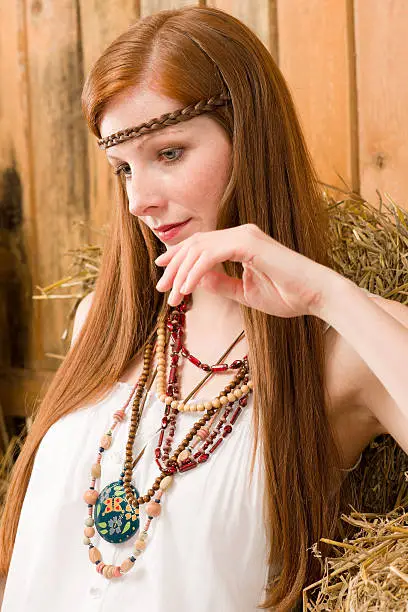 Fashion model - Hippie red-hair young woman countryside portrait