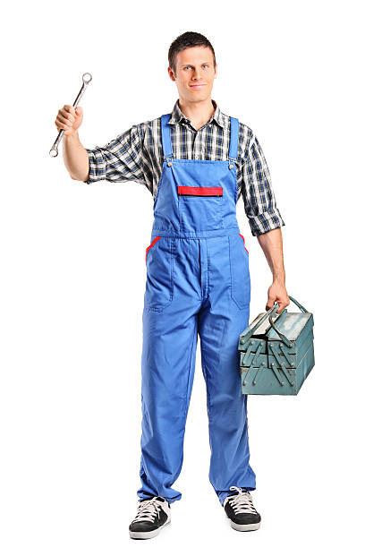 istock Repairman in overall holding a wrench and toolbox 155248821