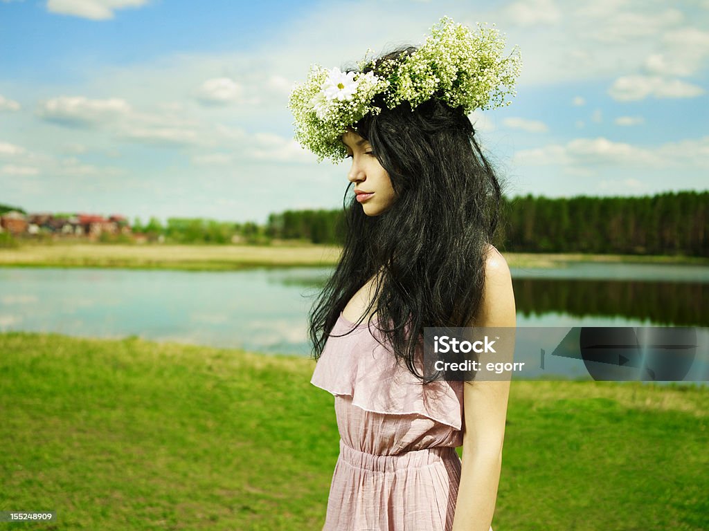 Beautiful girl wearing a wreath of wildflowers Fashion portrait beautiful girl wearing a wreath of wildflowers 20-24 Years Stock Photo