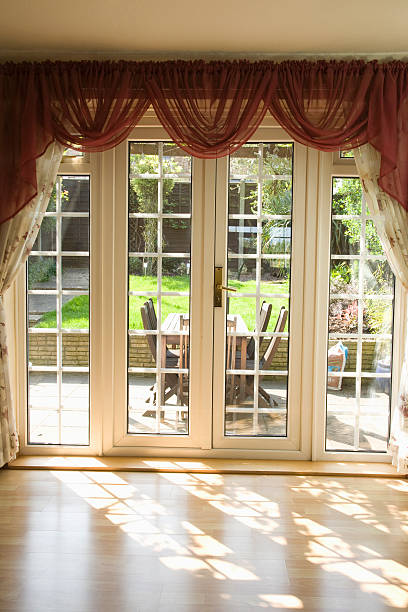 istock View of backyard from inside empty room through glass door 155249655