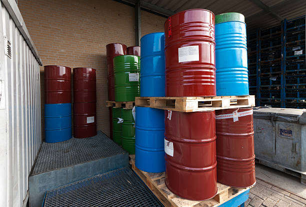istock Colored oil barrels stacked on pallets 155250784