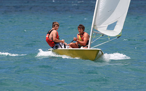 Two boys in a boat stock photo