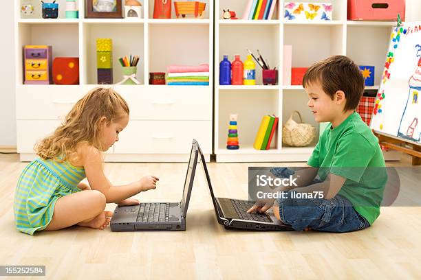 Kids Playing Computer Games Stock Photo - Download Image Now - Beauty, Boys, Brand Name Video Game