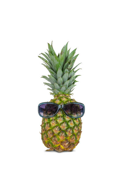 istock Pineapple with sunglasses isolated on white background. 1552533909