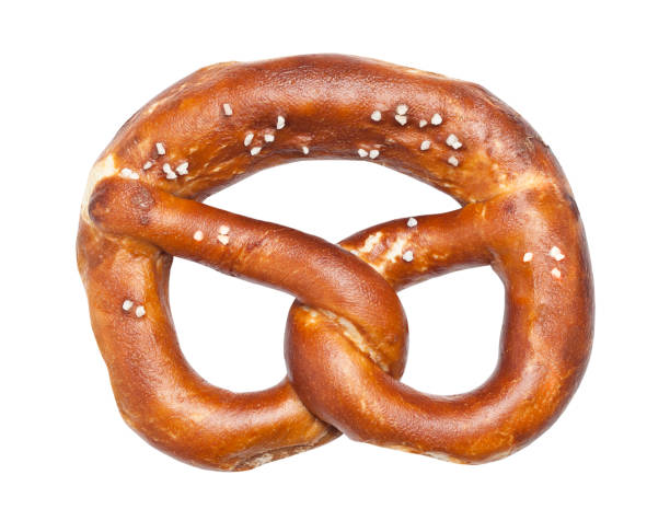 Portrait of an African American boy eating a large soft pretzel