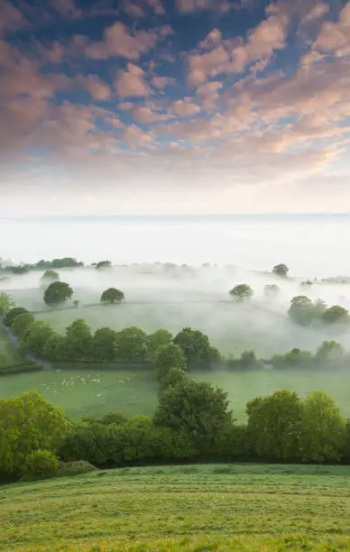 A beautiful summer sunrise from the top of the Tor at Glastonbury, Somerset, U.k