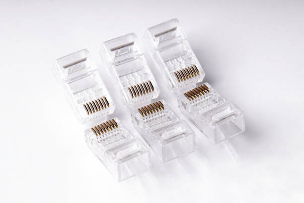 istock Close up of Network and ethernet cable isolated on white background. Modular plugs. LAN Cable. 1552568525