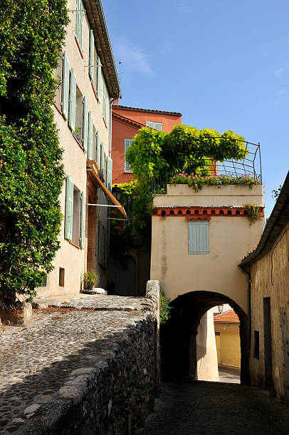 Alley in the french village of Biot Alley in the village of Biot in the Alpes-Maritimes department in France biot stock pictures, royalty-free photos & images