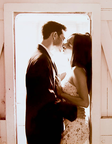 istock Kissing couple underneath a doorway 155258091