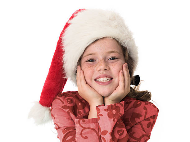 istock Young girl smiling to camera wearing christmas hat 155258624