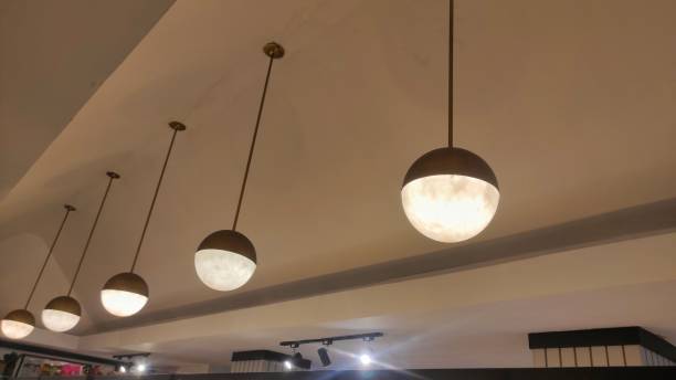 istock hanged ball-shape lamp decorations in ceiling of shop 1552597636