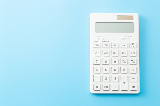 White calculator on blue background.